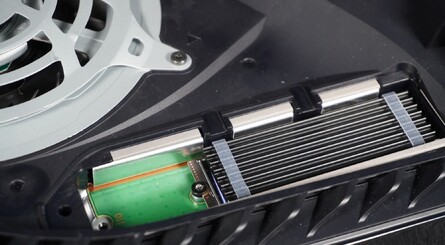 (Clockwise from top left) Fit the spacer and then insert the SSD into the slot as shown, making sure the contacts on the SSD line up with the contacts inside the slot. Push down to lock the SSD into place, refit the screw you removed earlier, and installation is complete!