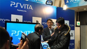 Sony executive Andrew House presents one lucky gamer with the world's first PlayStation Vita.