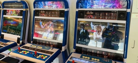Arcade cabinets at Pearl Abyss playing Tekken 7