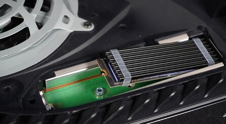 (Clockwise from top left) Fit the spacer and then insert the SSD into the slot as shown, making sure the contacts on the SSD line up with the contacts inside the slot. Push down to lock the SSD into place, refit the screw you removed earlier, and installation is complete!